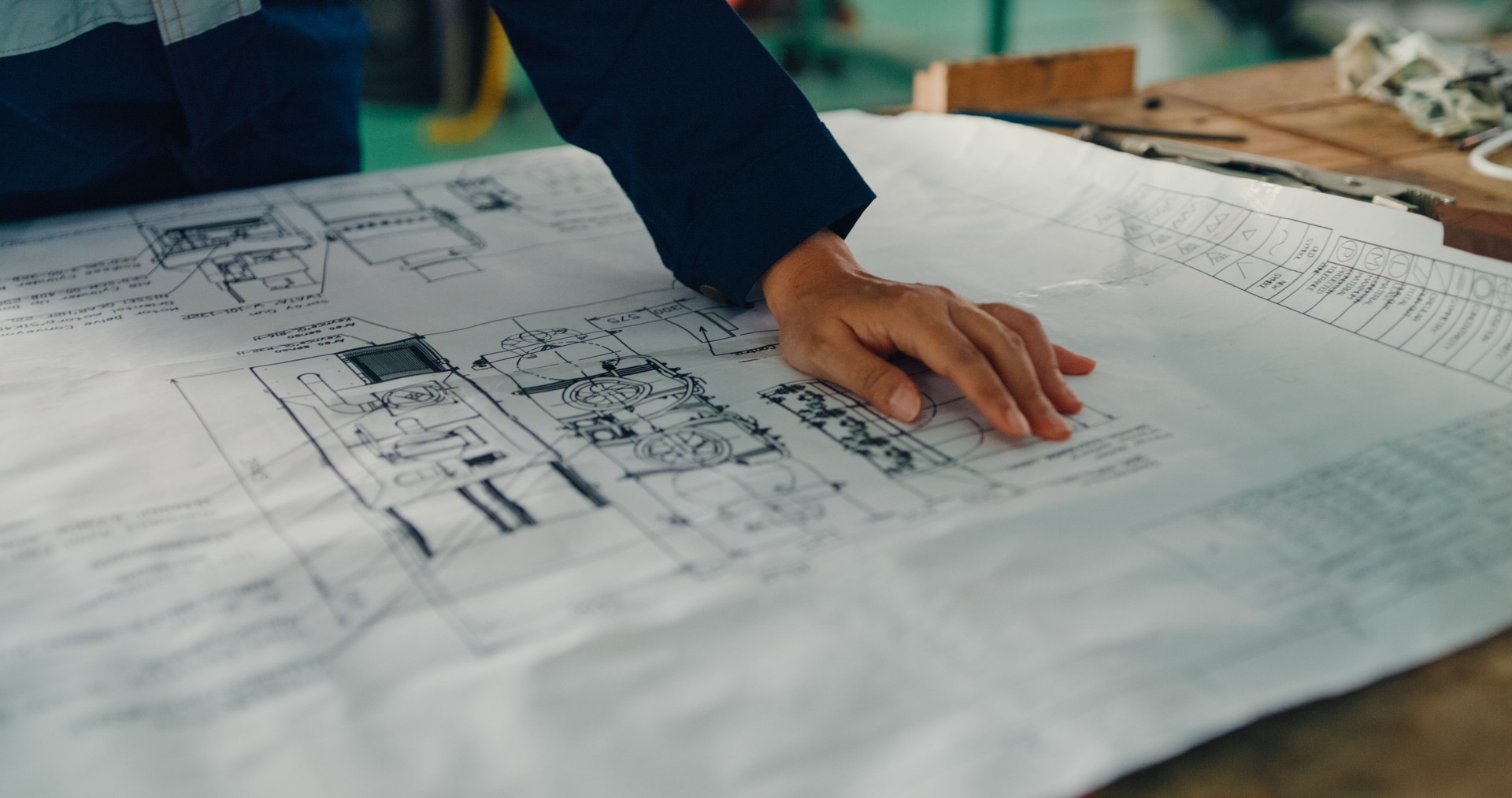 Professional Asian female industrial engineers working and managing projects on laptop computer in manufacturing factory. Engineering and sustainable production plant.